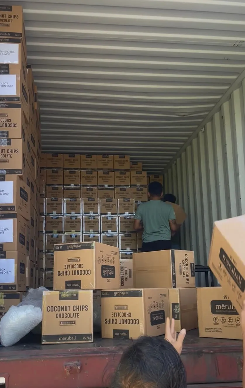Boxes of Merubali products loaded into a shipping container